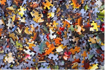 Many colourful puzzle pieces