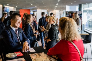 People networking at a conference.